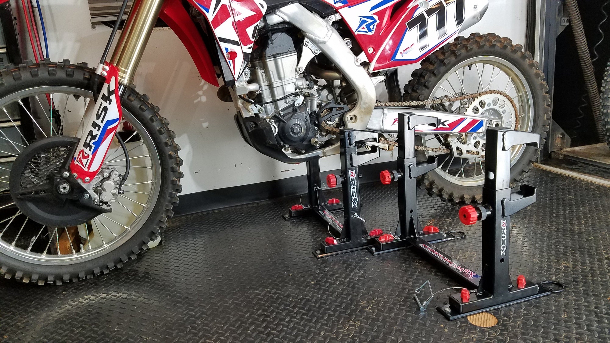 trailer with 2 lock-n-load moto transport systems. One empty and one with a dirt bike installed